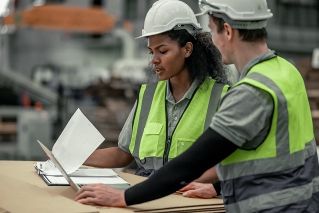 Two technicians discussing energy and sustainability solutions
